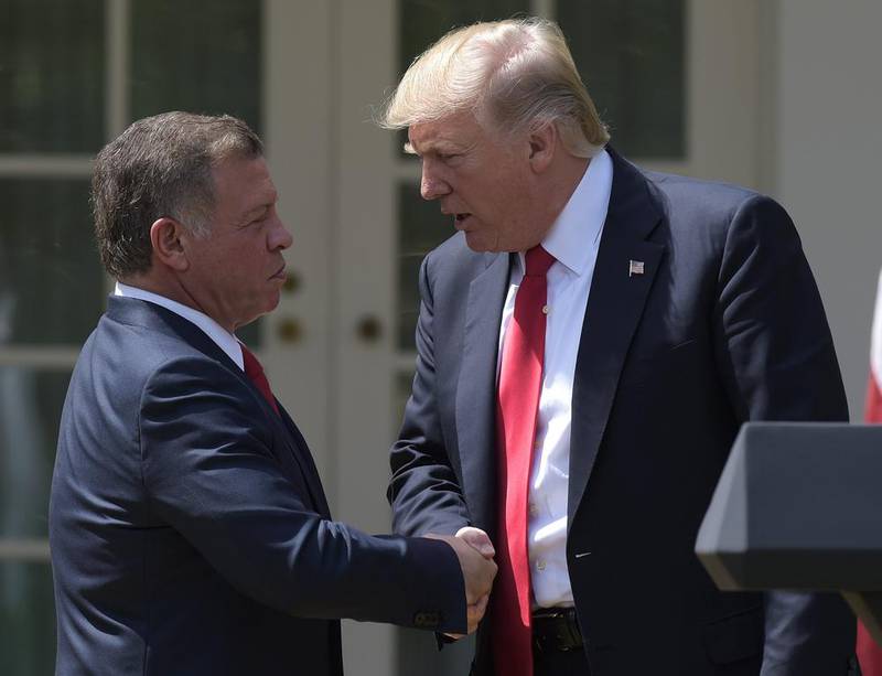 US president Donald Trump and Jordan's King Abdullah shake hands during a press conference in the rose garden of the White House on April 5, 2017. Susan Walsh / AP Photo