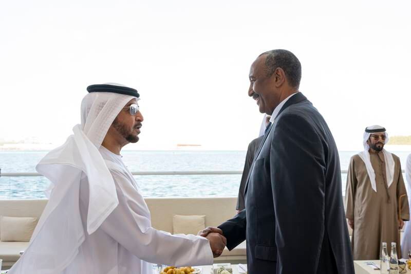 Sheikh Hamdan bin Zayed, Ruler's Representative in Al Dhafra region, greets Gen Al Burhan