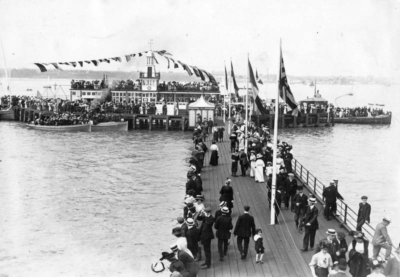 A crowd enjoys the pier in 1909. In 1829, the foundation stone of the first section of the pier was laid. By the following year, a 180-metre wooden pier had been opened.