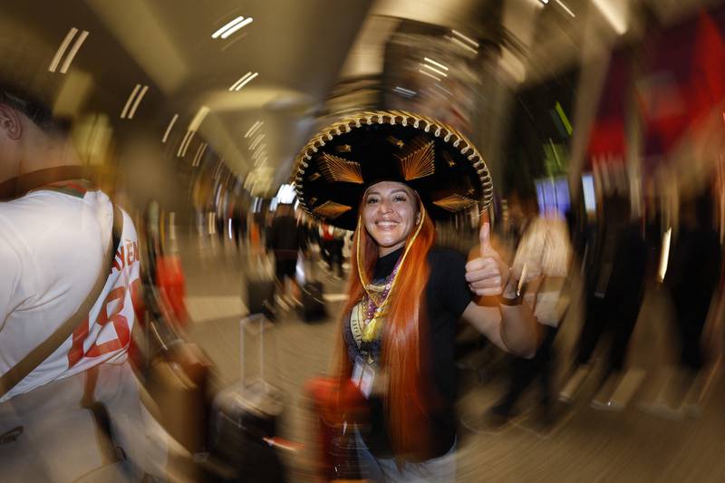 Good to be here: a Mexico fan arrives in Qatar. Reuters