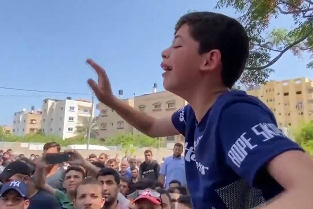 Heartbroken Palestinian boy follows his father's funeral
