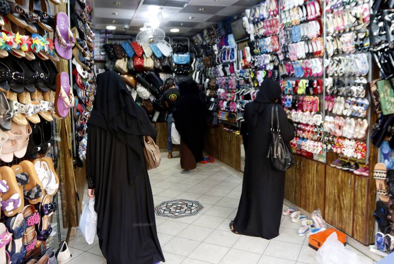 Women shop for shoes in September 2014. Reuters