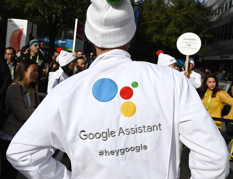 (FILES) In this file photo taken on January 08, 2019, attendees wait to ask a question of a Google Assistant at a giant "Hey Google" gumball machine game at CES 2019 at the Las Vegas Convention Center in Las Vegas, Nevada.  Google said on November 19, 2019, its digital assistant will serve as a "news host" on its connected devices to deliver stories from a variety of its media partners. The feature called Your News Update will be activated by asking the Google Assistant to read the news. / AFP / Robyn Beck
