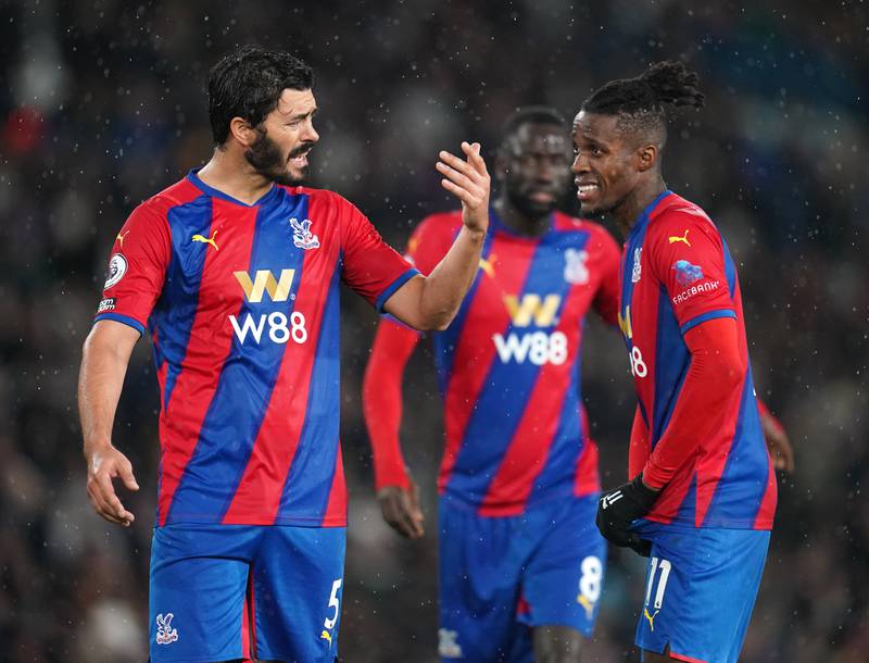 Crystal Palace's James Tomkins (left) and Wilfried Zaha react during the Premier League match at Elland Road, Leeds. Picture date: Tuesday November 30, 2021.
