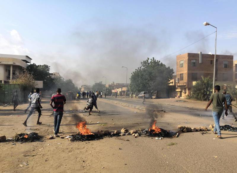 Tyres are set ablaze by Sudanese protesters. AFP