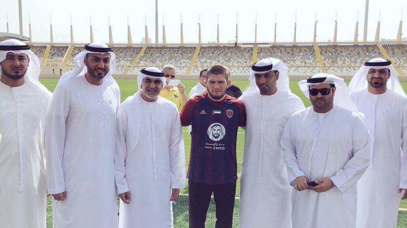 UFC lightweight champion Khabib Nurmagomedov poses with Al Wahda FC officials at the club's Al Nahyan Stadium in Abu Dhabi. Courtesy Al Wahda FC