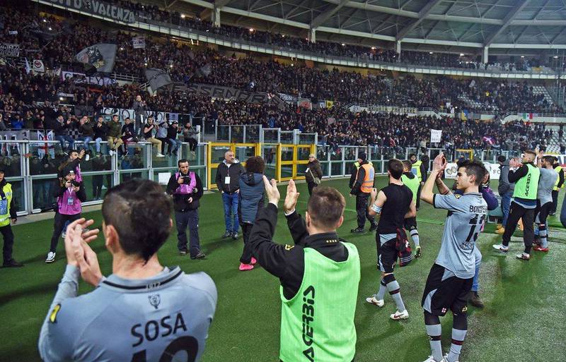 Alessandria players cheer their supporters after the 1-0 Coppa Italia semi-final first leg loss on Tuesday night to AC Milan in Turin. Andrea Di Marco / EPA