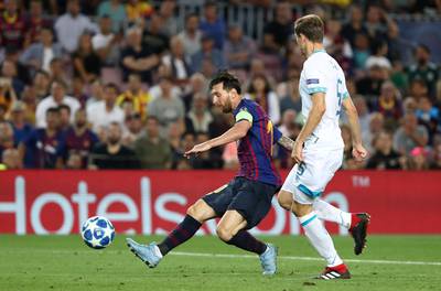 Barcelona's Lionel Messi scores their fourth goal to complete his hat-trick. Reuters