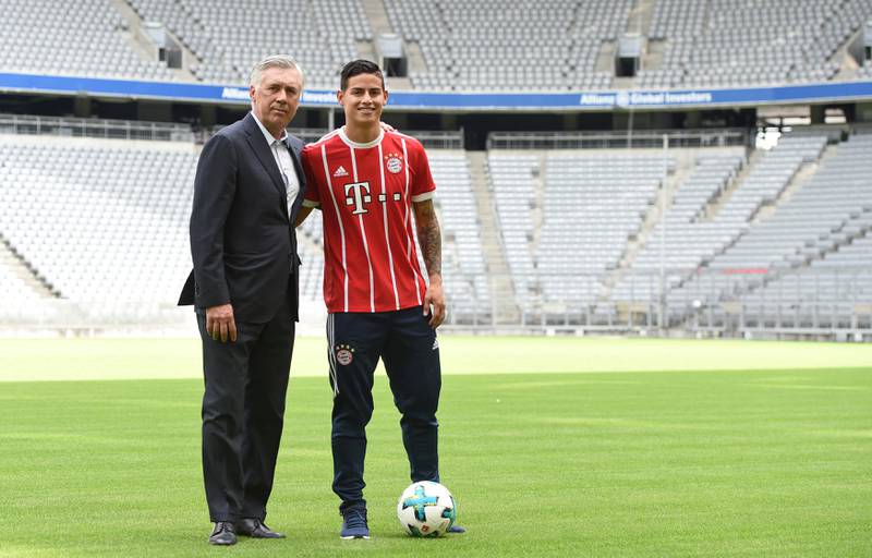 Colombian midfielder James Rodriguez presents his new match jersey with Bayern Munich coach Carlo Ancelotti in Munich, Germany July 12, 2017. REUTERS/Andreas Gebert