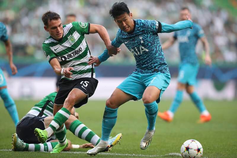 Tottenham attacker Son Heung-min under pressure from
Sporting's Manuel Ugarte. EPA