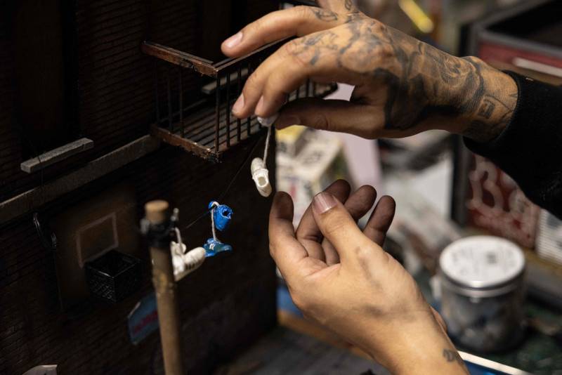 Danny Cortes, a street-miniature artist, in his studio in the Brooklyn borough of New York City. All photos: AFP