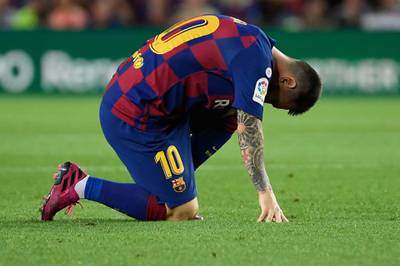 Barcelona's Argentine forward Lionel Messi reacts injured on the ground. AFP