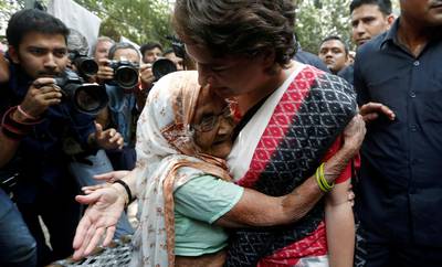 Priyanka Gandhi Vadra, leader of India's main opposition Congress party and sister of party's president Rahul Gandhi, is hugged by an elderly woman at a polling station in New Delhi, India. Reuters