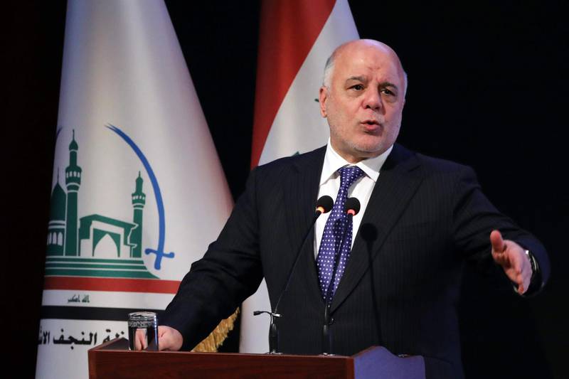 (FILES) This file photo taken on January 07, 2018 shows Iraqi Prime Minister Haider al-Abadi delivering a speech during a ceremony in the Shiite holy city of Najaf.
Abadi announced plans on January 14, 2018 to run for re-election in May at the head of a new coalition separate from key rival and Dawa party co-member Nuri al-Maliki. / AFP PHOTO / Haidar HAMDANI