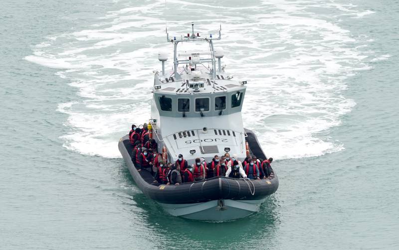 Migrants are taken to Dover, in England, on a Border Force vessel after being rescued from the Channel on May 2. PA