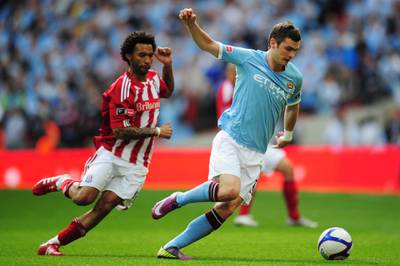 LONDON, ENGLAND - MAY 14: Adam Johnson (R) of Manchester City holds off Jermaine Pennant (L) of Stoke City during the FA Cup sponsored by E.ON Final match between Manchester City and Stoke City at Wembley Stadium on May 14, 2011 in London, England. (Photo by Shaun Botterill/Getty Images)