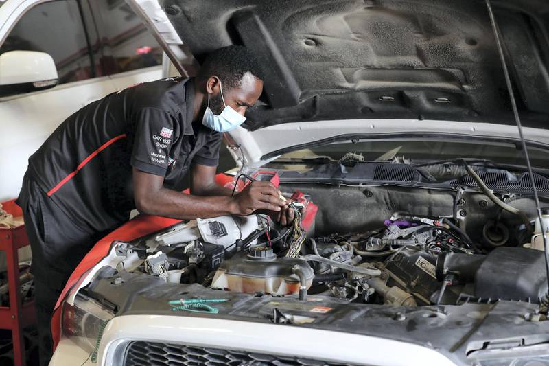 Dubai, United Arab Emirates - Reporter: N/A. News. Coronavirus/Covid-19. Members of Regal Auto care fix cars with Covid protection measures in place. Tuesday, September 1st, 2020. Dubai. Chris Whiteoak / The National