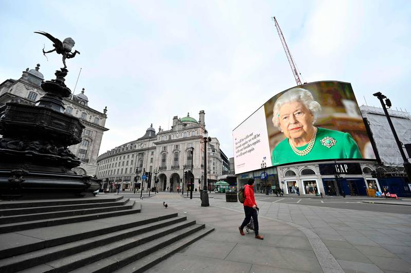 A still image of Britain's Queen Elizabeth II with a message of hope from her special address to the nation is seen on the giant billboard in Piccadilly Square, central London.  AFP