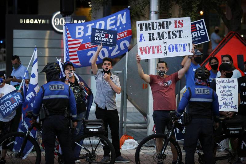 Supporters of Joe Biden gather outside Perez Art Museum before the arrival of Donald Trump for the town hall in Miami, Florida. Reuters