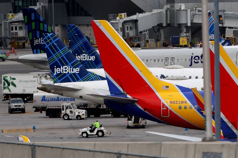 Commercial planes park at gates after flights were grounded at LaGuardia Airport in New York. Reuters