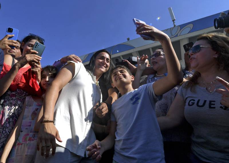 Supporters take selfies with Jabeur upon her return to  Tunis after Wimbeldon. AFP