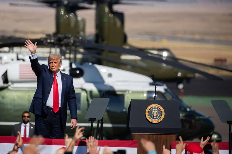 PRESCOTT, AZ - OCTOBER 19: U.S. President Donald Trump waves to the crowd before departing at a Make America Great Again campaign rally on October 19, 2020 in Prescott, Arizona. With almost two weeks to go before the November election, President Trump is back on the campaign trail with multiple daily events as he continues to campaign against Democratic presidential nominee Joe Biden.   Caitlin O'Hara/Getty Images/AFP
== FOR NEWSPAPERS, INTERNET, TELCOS & TELEVISION USE ONLY ==
