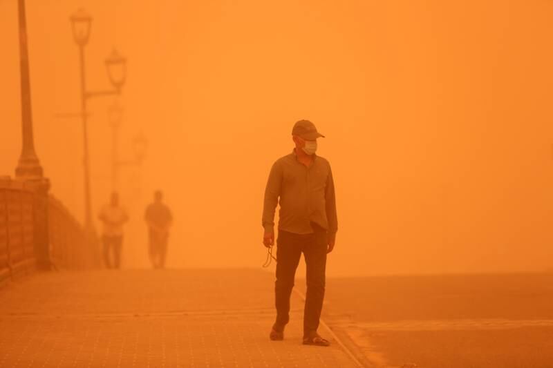 A man walks among dust in central Baghdad, Iraq. EPA
