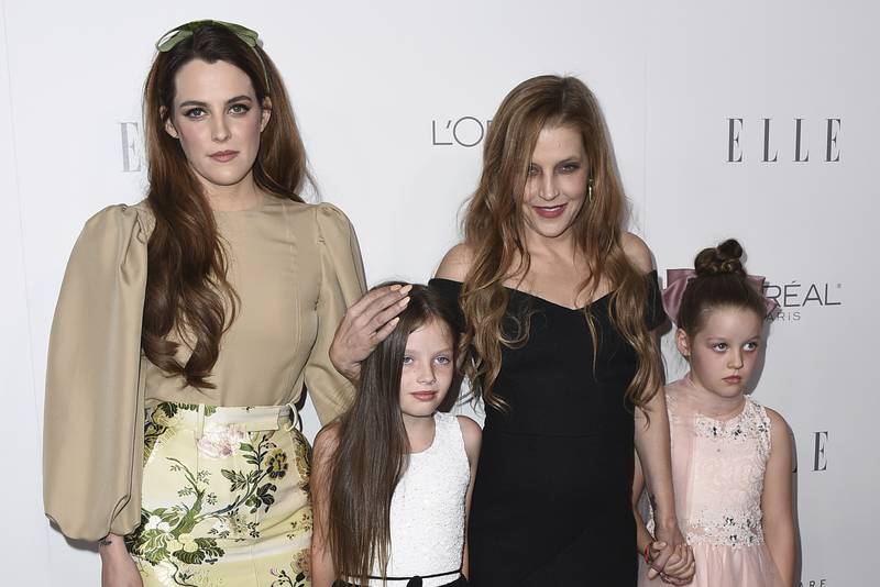 With her daughters Riley Keough, left, and twins Finley and Harper Lockwood. Invision / AP