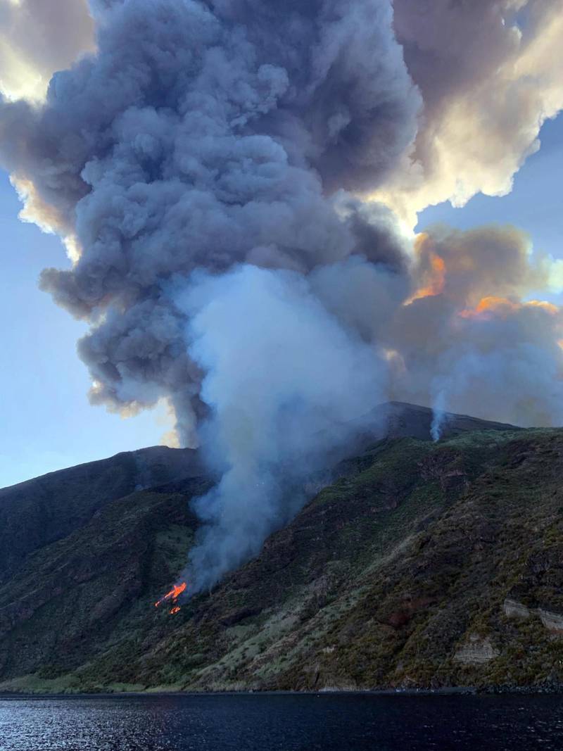Ash rises into the sky after a volcano eruption on a small island of Stromboli, Italy. According to reports, the island of Stromboli was hit by a set of violent volcano eruptions spurring beach tourists to take into the sea. Two new lava spouts are creeping down the volcano.  EPA