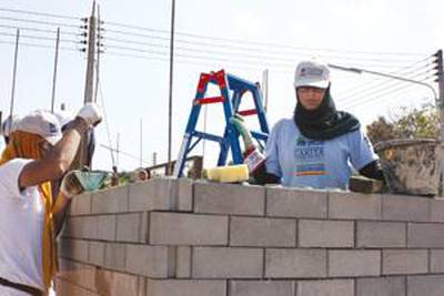 A volunteer with the UAE-based charity, Takatof.