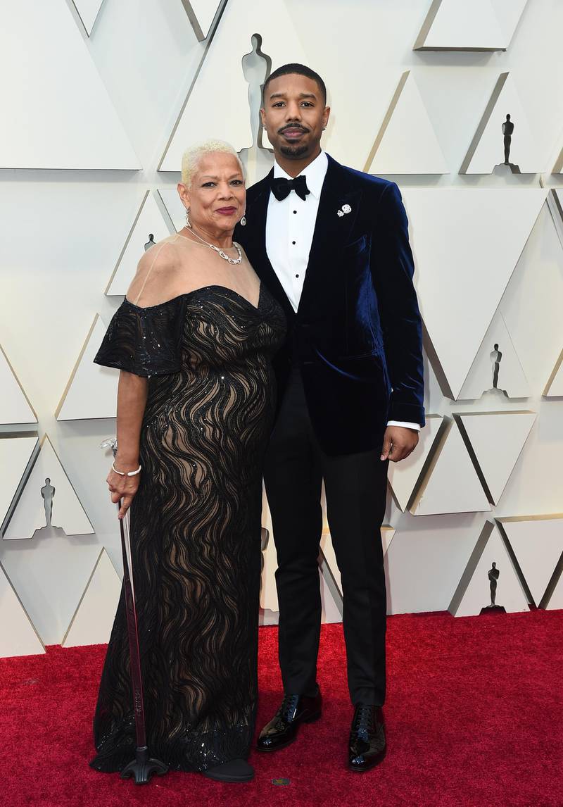 Michael B. Jordan, right, in Tom Ford and Donna Jordan at the 91st Academy Awards. AP