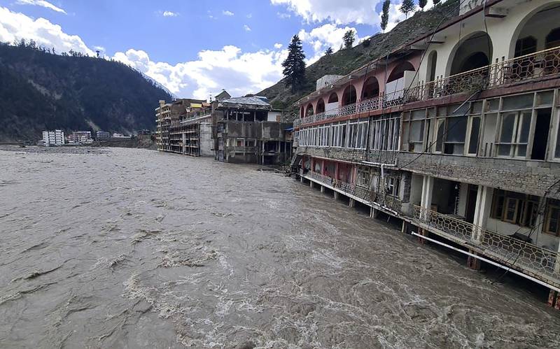 Hotels are surrounded by floodwaters in Kalam. AP