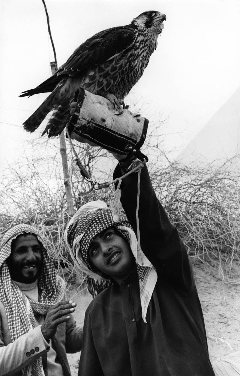 Sheikh Mohamed is known for his love of falconry. Here he is pictured with one of the birds of prey during a visit to Pakistan in 1970s. Photo: National Archives