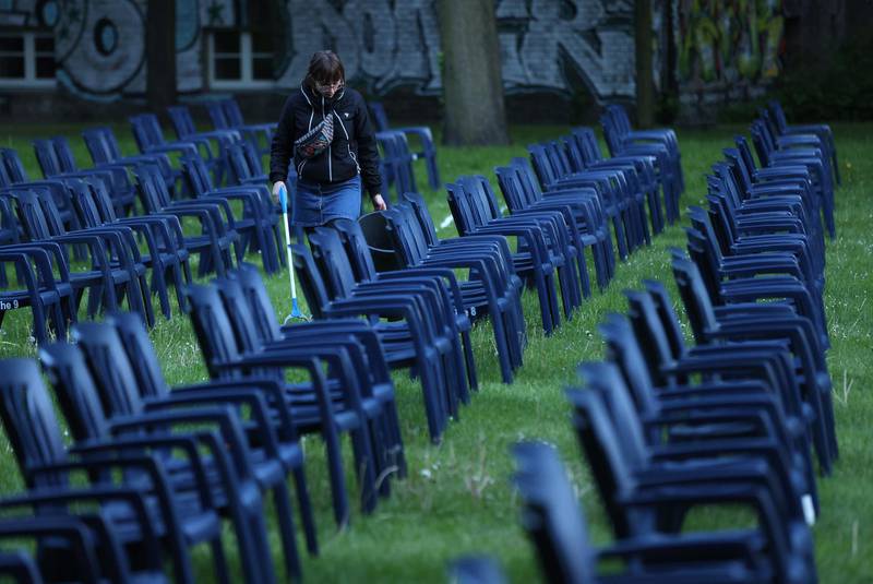 A cinema employee does a last-minute clean before people arrived to watch a film at the Freiluftkino Kreuzberg open-air cinema for the first time this year in Berlin, Germany. Getty Images