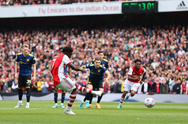 Arsenal's Bukayo Saka scores their second goal from the penalty spot. Reuters