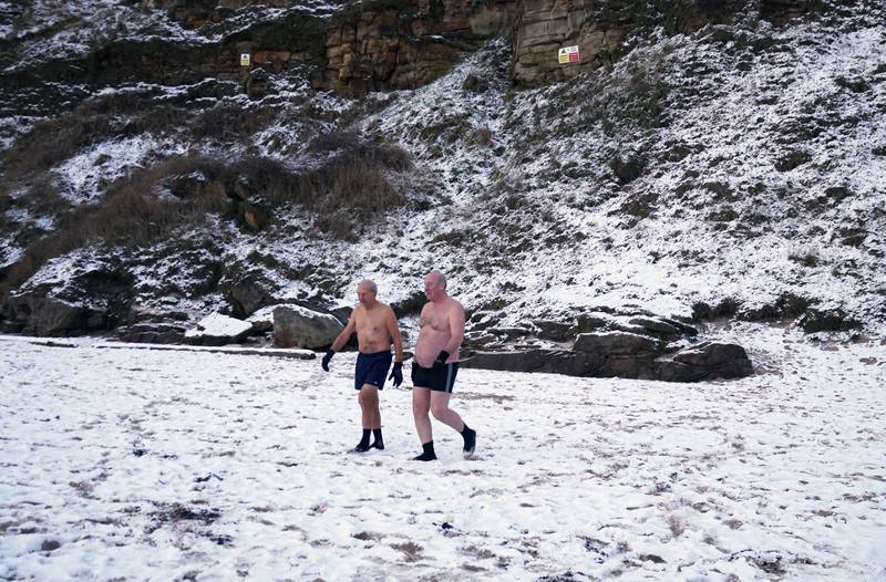 Swimmers brave the cold at King Edward's Bay, near Tynemouth on the north-east coast. PA