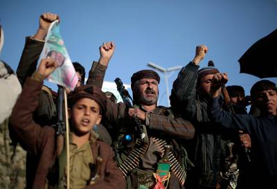 In this Jan. 25, 2021 photo, Houthi supporters chant slogans as they attend a demonstration against the United States over its decision to designate the Houthis a foreign terrorist organization in Sanaa, Yemen. President Joe Biden is distancing himself from Saudi Arabia's rulers over their war in Yemen and rights abuses. That includes Biden announcing Feb. 4, 2021, he would make good on a campaign pledge to cut U.S. support for a five-year Saudi-led military campaign in neighboring Yemen.  (AP Photo/Hani Mohammed)