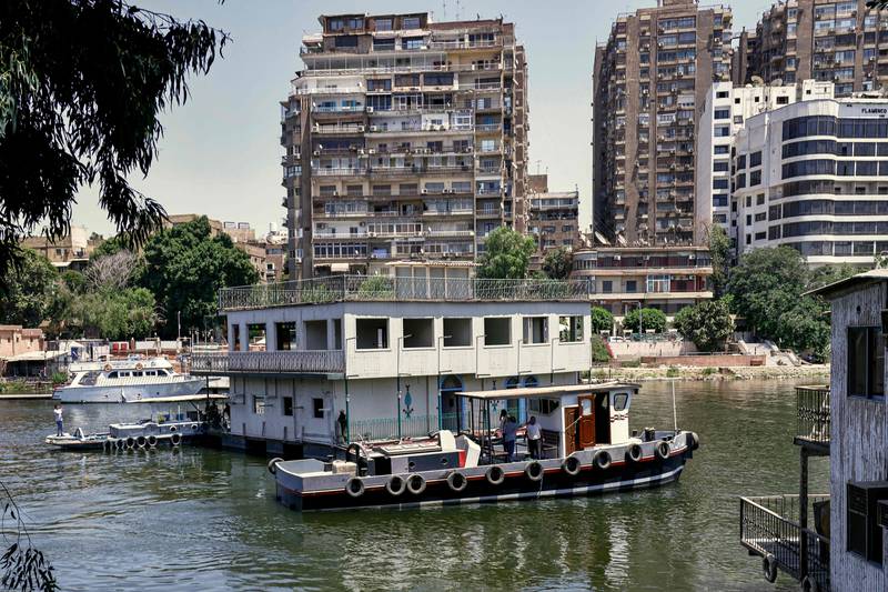 One of the houseboats usually moored between the Zamalek district of Egypt's capital Cairo and the Agouza district of its twin city of Giza is towed away by authorities.