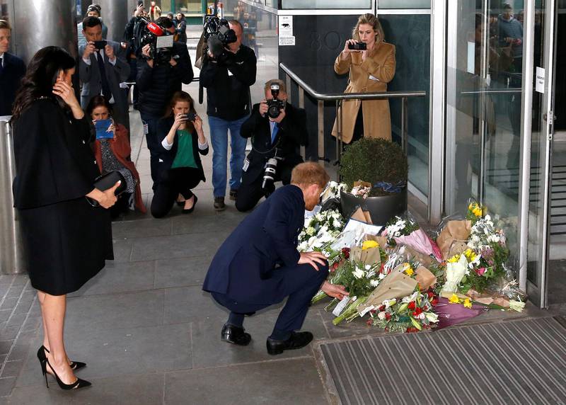 The royal couple laid floral tributes alongside those left outside the High Commission by members of the public. Reuters