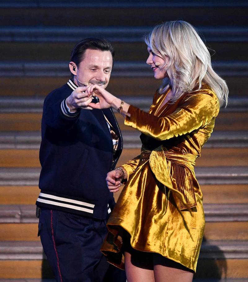 TOPSHOT - Olympique Lyonnais' Norwegian forward Ada Hegerberg (R) dances with French DJ and producer Martin Solveig after receiving the 2018  Women's Ballon d'Or award for best player of the year during the 2018 Ballon d'Or award ceremony at the Grand Palais in Paris on December 3, 2018.  / AFP / FRANCK FIFE
