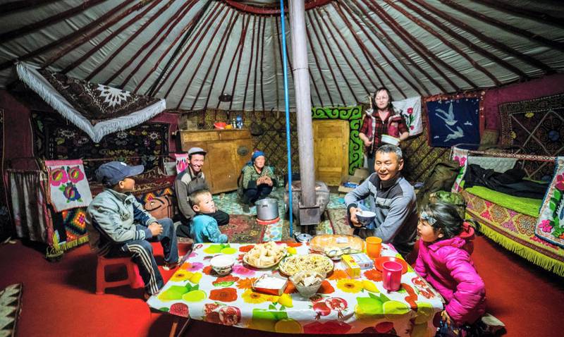 A Mongolian nomad family in their ger in the mountains of Altai. Courtesy Xaviar Smerdon / New Milestone Tours