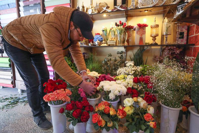 A flower shop owner in Idlib prepares a bouquet of fresh carnations, grown in the north-western Syrian province. AFP