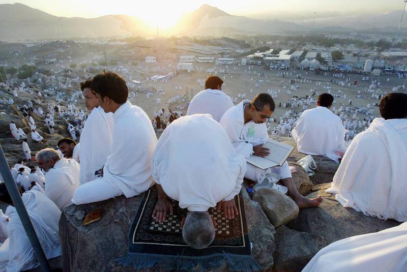 A Hajj pilgrim prays on Jabal Arafat in 2004.