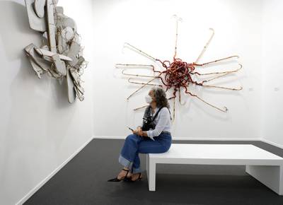 Dubai, United Arab Emirates - Reporter: Alexandra Chaves. Arts and Lifestyle. A visitor looks at a piece by Mohamed Arejdal called Spiritualités vierges. Art Dubai 2021 opens at the DIFC. Tuesday, March 30th, 2021. Dubai. Chris Whiteoak / The National
