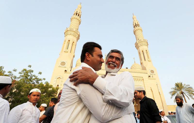 DUBAI, UNITED ARAB EMIRATES, August 21 – 2018 :- People greeting each other after the Eid Al Adha prayers at the Jumeirah Mosque in Dubai. ( Pawan Singh / The National )  For News. Story by Nawal