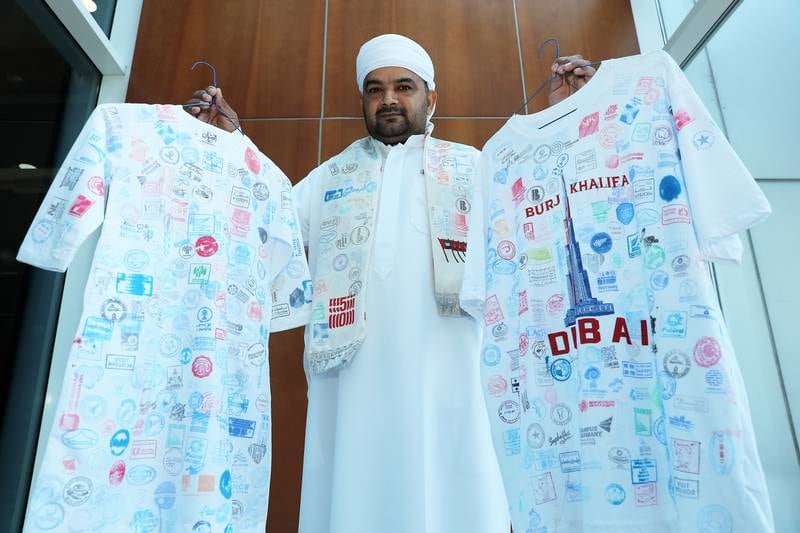 Both kandoras are covered with stamps from all of the pavilions at Expo 2020 Dubai.