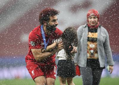 Liverpool's Mohamed Salah celebrates with his daughter and wife after winning the Champions League Final. Reuters