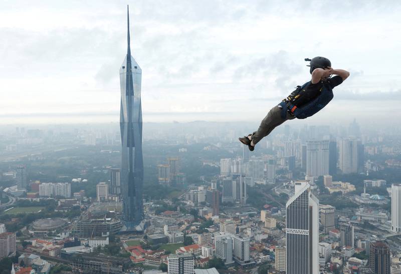 A base jumper leaps off the Kuala Lumpur Tower during the annual KL Tower International Jump Malaysia 2023 in Kuala Lumpur. Reuters 