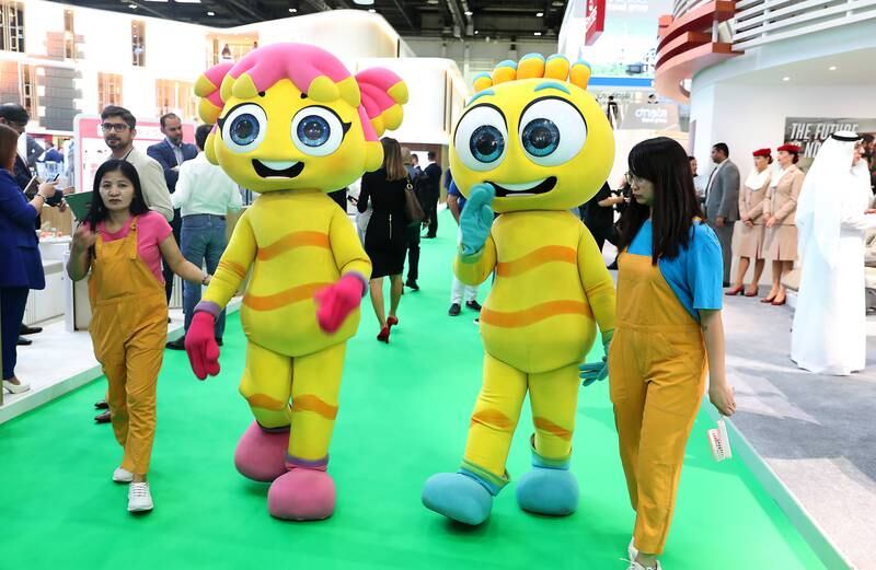 Mascots walk the green carpet at the conference. Pawan Singh / The National
