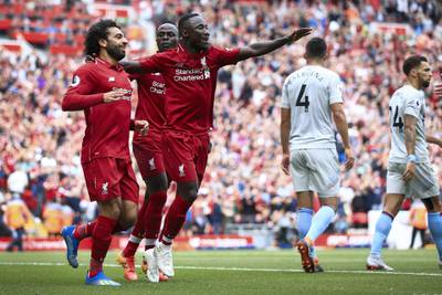 LIVERPOOL, ENGLAND - AUGUST 12: Mohamed Salah of Liverpool (L) celebrates with Naby Keita of Liverpool (R) and Sadio Mane of Liverpool (C) after scoring their 1st goal during the Premier League match between Liverpool and West Ham United at Anfield on August 12, 2018 in Liverpool, England. (Photo by Simon Stacpoole/Offside/Getty Images)